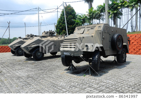 PORT DICKSON, MALAYSIA -MAY 08, 2016: Old army armor vehicle and tanks restored and display for public at Malaysia Army Museum or Muzium Tentera Darat in Port Dickson, Negeri Sembilan, Malaysia. PORT DICKSON, MALAYSIA -MAY 08, 2016: Old army armor vehicle and tanks restored and display for public at Malaysia Army Museum or Muzium Tentera Darat in Port Dickson, Negeri Sembilan, Malaysia. 86341997