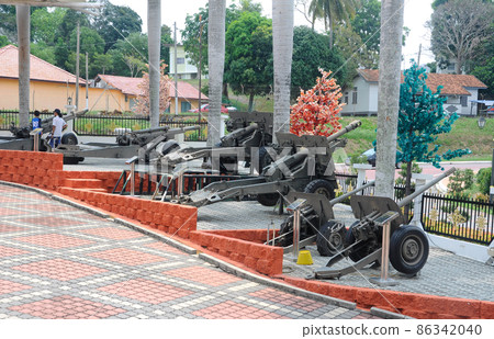PORT DICKSON, MALAYSIA -MAY 08, 2016: Old war cannon restored and display for public at Malaysia Army Museum or Muzium Tentera Darat in Port Dickson, Negeri Sembilan, Malaysia. PORT DICKSON, MALAYSIA -MAY 08, 2016: Old war cannon restored and display for public at Malaysia Army Museum or Muzium Tentera Darat in Port Dickson, Negeri Sembilan, Malaysia. 86342040