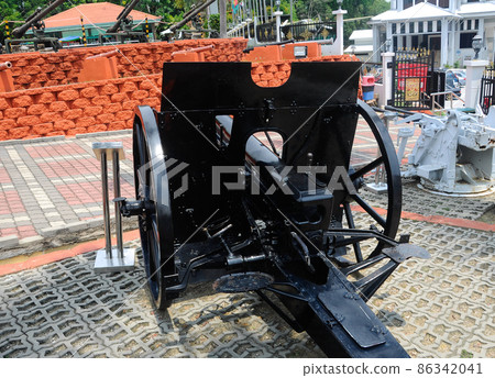 PORT DICKSON, MALAYSIA -MAY 08, 2016: Old war cannon restored and display for public at Malaysia Army Museum or Muzium Tentera Darat in Port Dickson, Negeri Sembilan, Malaysia. PORT DICKSON, MALAYSIA -MAY 08, 2016: Old war cannon restored and display for public at Malaysia Army Museum or Muzium Tentera Darat in Port Dickson, Negeri Sembilan, Malaysia. 86342041