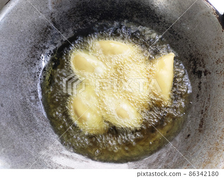 Malaysian curry puffs. Also known as karipap. It is one of the traditional food in Malaysia. Skin made from the wheat flour mixture and the inside is potato and curry mixture. 86342180