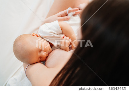 breastfeeding. view from above. the mother feeds the baby with breast milk. breastfeeding. view from above. the mother feeds the baby with breast milk. 86342685