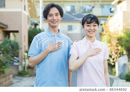 Staff standing in a residential area 86344692