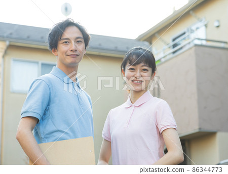 Staff standing in a residential area Staff standing in a residential area 86344773