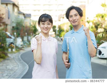 Staff standing in a residential area Staff standing in a residential area 86344777