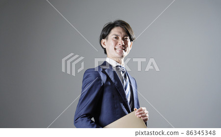 Businessman portrait gray background 86345348