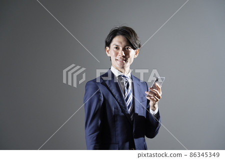 Businessman smartphone gray background 86345349