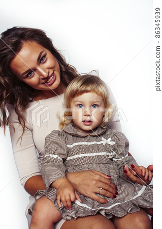 bright picture of hugging mother and daughter happy together, smiling stylish family. lifestyle people concept bright picture of hugging mother and daughter happy together, smiling stylish family. lifestyle people concept 86345939