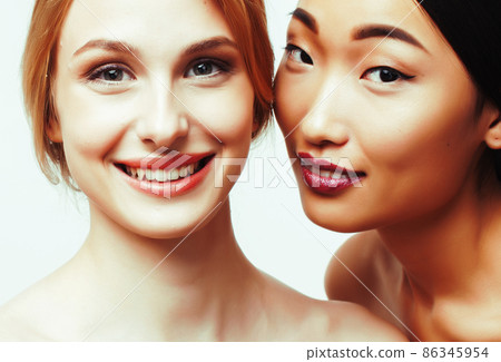 different nation woman: caucasian and asian together isolated on white background happy smiling, diverse type on skin, lifestyle people concept 86345954