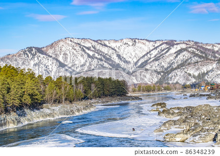 winter mountain landscape with an ice frozen river winter mountain landscape with an ice frozen river 86348239
