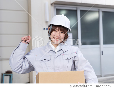 Cardboard and female worker guts pose 86348369