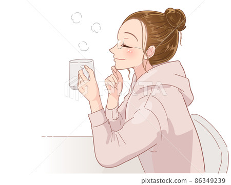 Young woman relaxing with a drink in a glass 86349239