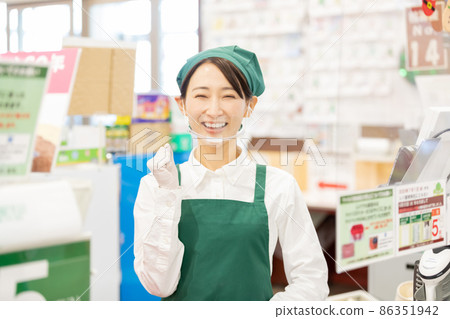 A woman working at super cash register A woman working at super cash register 86351942