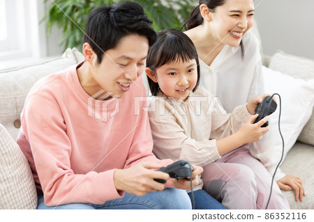 Home time: Family enjoying video games Home time: Family enjoying video games 86352116