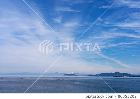 Okishima and Mt. Ibuki looking far from the top of Lake Biwa Bridge in winter 86353202