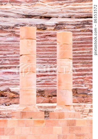 Columns at ancient theatre in Petra (Red Rose City), Jordan. Petra is UNESCO World Heritage Site and is one of New7Wonders of the World. 86353572