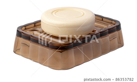 New soap on a dish isolated on white background New soap on a dish isolated on white background 86353782