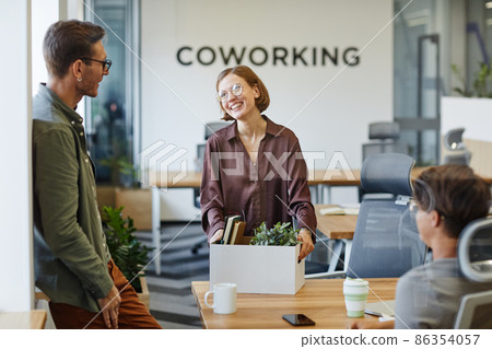 Smiling Young Woman at New Job Smiling Young Woman at New Job 86354057
