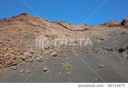 Landscape near El Cuervo volcano at Lanzarote island, Canary Islands 86354875