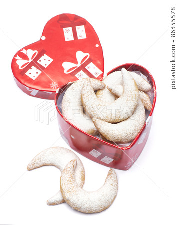Heart shaped Gift box full of Traditional German or Austrian Vanillekipferl vanilla kipferl cookies Heart shaped Gift box full of Traditional German or Austrian Vanillekipferl vanilla kipferl cookies 86355578