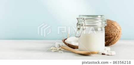 Coconut oil in jar with fresh coconut, Spa cosmetic and food ingredient, banner, copy space Coconut oil in jar with fresh coconut, Spa cosmetic and food ingredient, banner, copy space 86356218