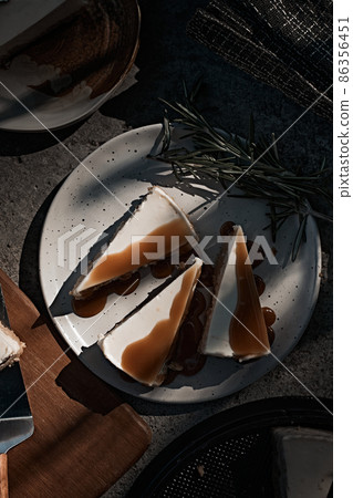 Slice of cheesecake with caramel sauce Slice of cheesecake with caramel sauce 86356451