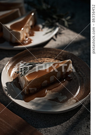 Slice of cheesecake with caramel sauce Slice of cheesecake with caramel sauce 86356452