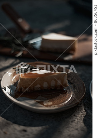 Slice of cheesecake with caramel sauce Slice of cheesecake with caramel sauce 86356453