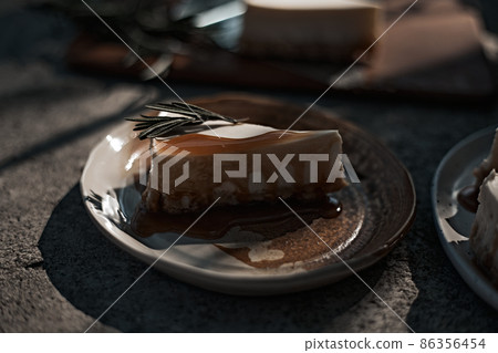 Slice of cheesecake with caramel sauce Slice of cheesecake with caramel sauce 86356454