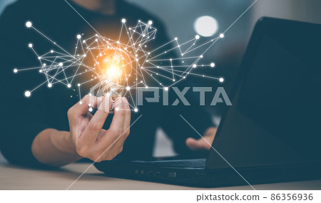 Businessman holding a bright light bulb, creativity with light bulbs and energy power, hand of a man with a light bulb and line light icon and using a notebook computer, technology innovation idea Businessman holding a bright light bulb, creativity with light bulbs and energy power, hand of a man with a light bulb and line light icon and using a notebook computer, technology innovation idea 86356936