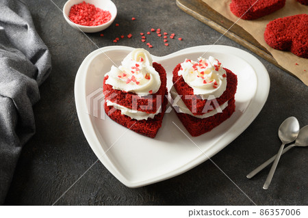 Heart shaped red velvet cake for Valentine's day. Tasty homemade dessert. 86357006