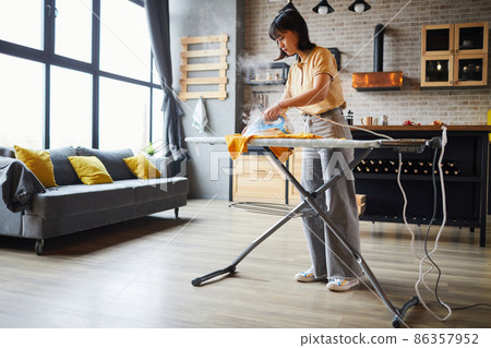 Young Woman doing Chores 86357952