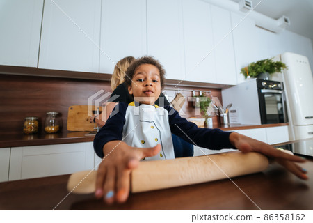 Happy family having fun in the kitchen. 86358162