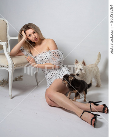Woman with blonde hair on grey Woman with blonde hair on grey 86358264