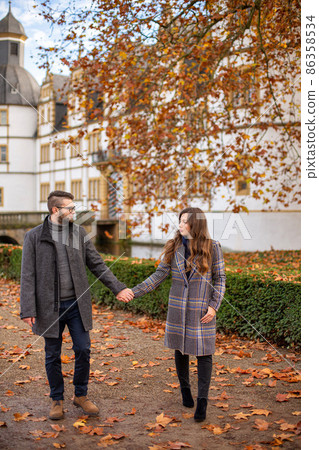 White young european couple with building behind 86358534