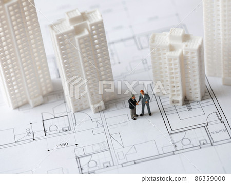 Miniature figures of high-rise apartments and businessmen Miniature figures of high-rise apartments and businessmen 86359000