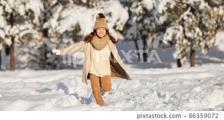 happy child girl runs through the winter snow park happy child girl runs through the winter snow park 86359072