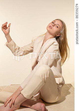 White young european woman isolated on beige White young european woman isolated on beige 86359274