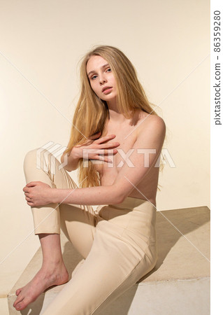 White young european woman isolated on beige White young european woman isolated on beige 86359280