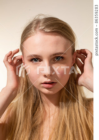 White young european woman isolated on beige White young european woman isolated on beige 86359283
