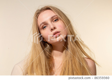White young european woman isolated on beige White young european woman isolated on beige 86359360