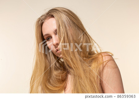 White young european woman isolated on beige White young european woman isolated on beige 86359363