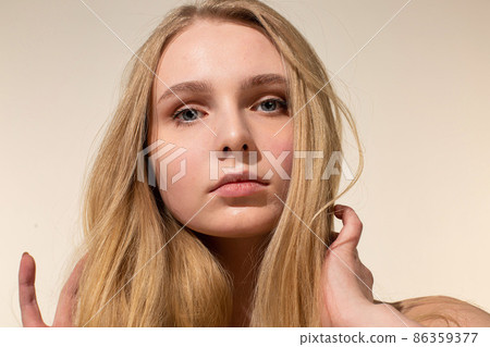 White young european woman isolated on beige White young european woman isolated on beige 86359377