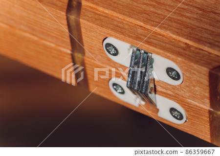 Stainless door hinges on wooden swing door. Stainless door hinges on wooden swing door. 86359667