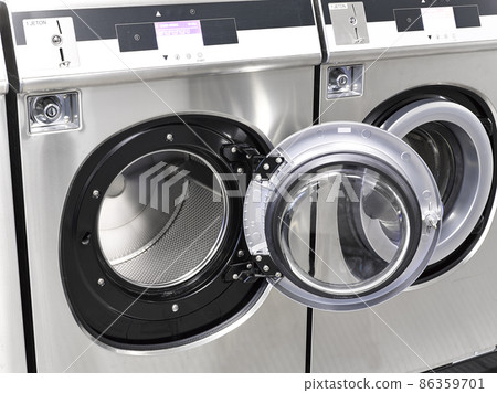 Industrial washing machines in a public laundromat 86359701