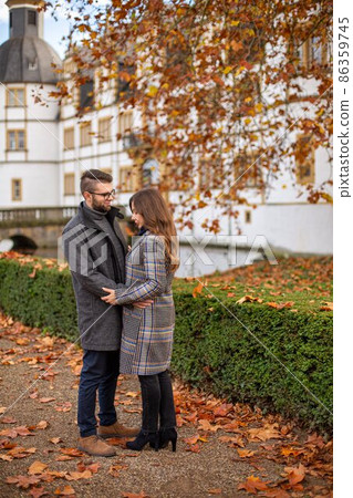 White young european couple with building behind 86359745