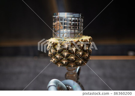 Stylish hookah with the aroma pineapple for relax.Pineapple shisha.Hookah lounge. 86360200