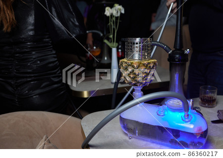 Stylish hookah with the aroma pineapple for relax.Pineapple shisha.Hookah lounge. 86360217