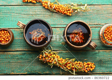 Tea with sea buckthorn berries Tea with sea buckthorn berries 86360722