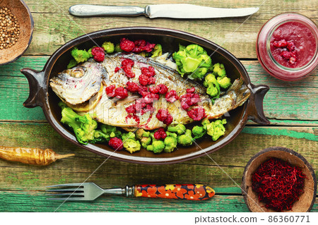 Appetizing gilthead fish in berry sauce. Appetizing gilthead fish in berry sauce. 86360771