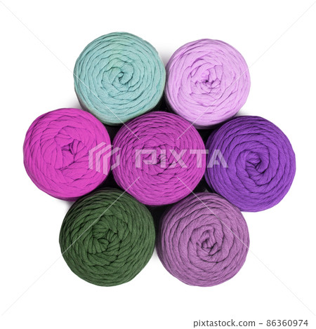Colorful macrame yarns isolated on white background. Flat lay of natural cotton macrame yarn rolls 86360974